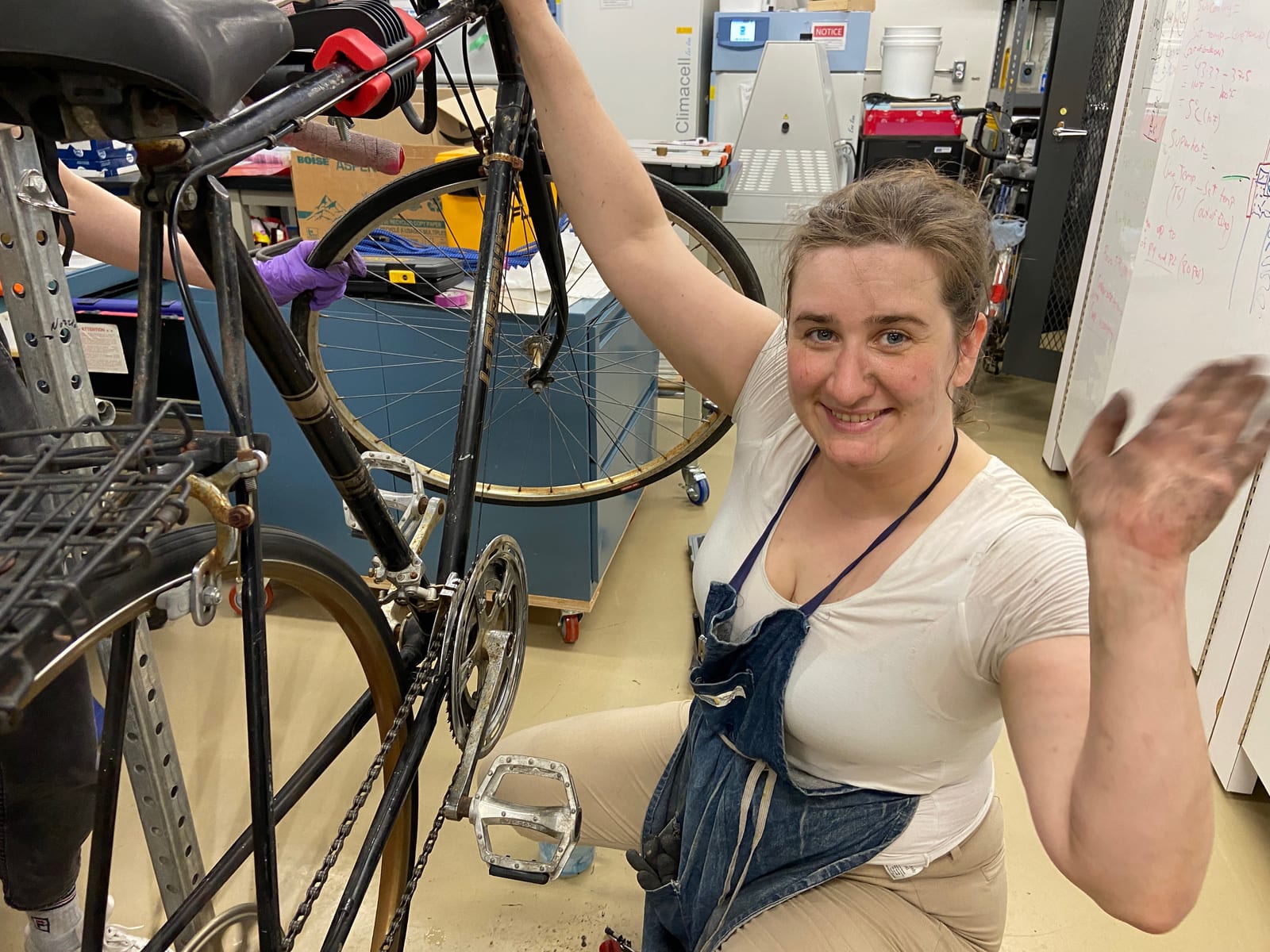 Helen repairing a bicycle in the lab