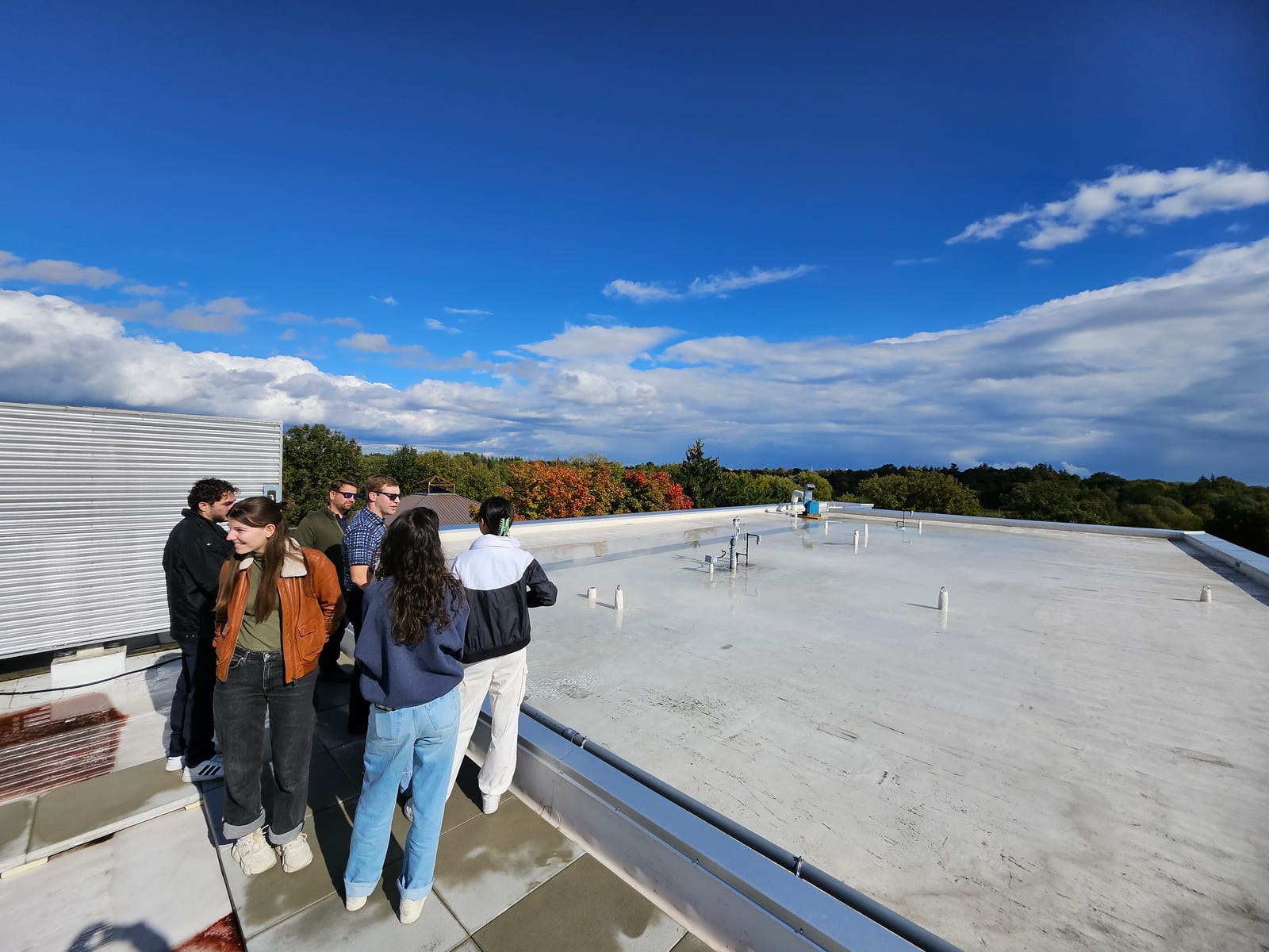 Lab members visiting a blue-roof installation