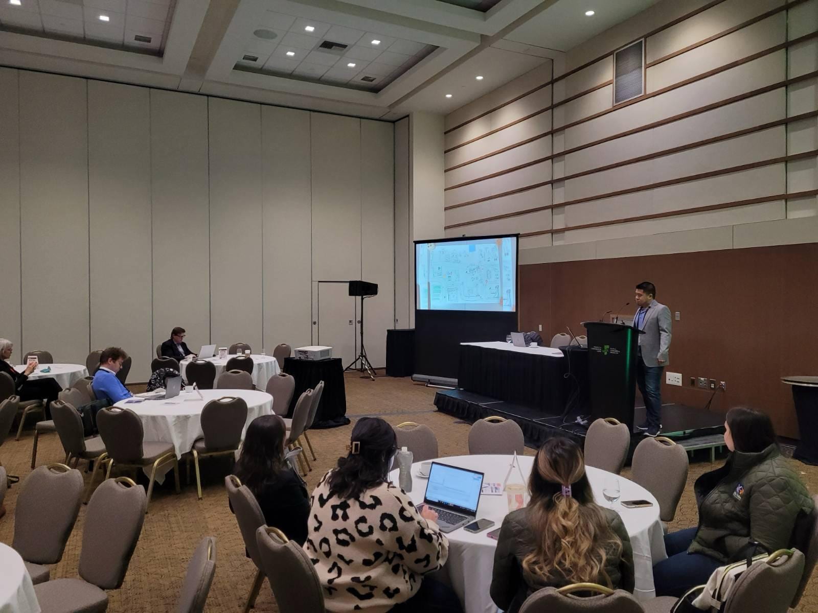 A research presentation at a conference