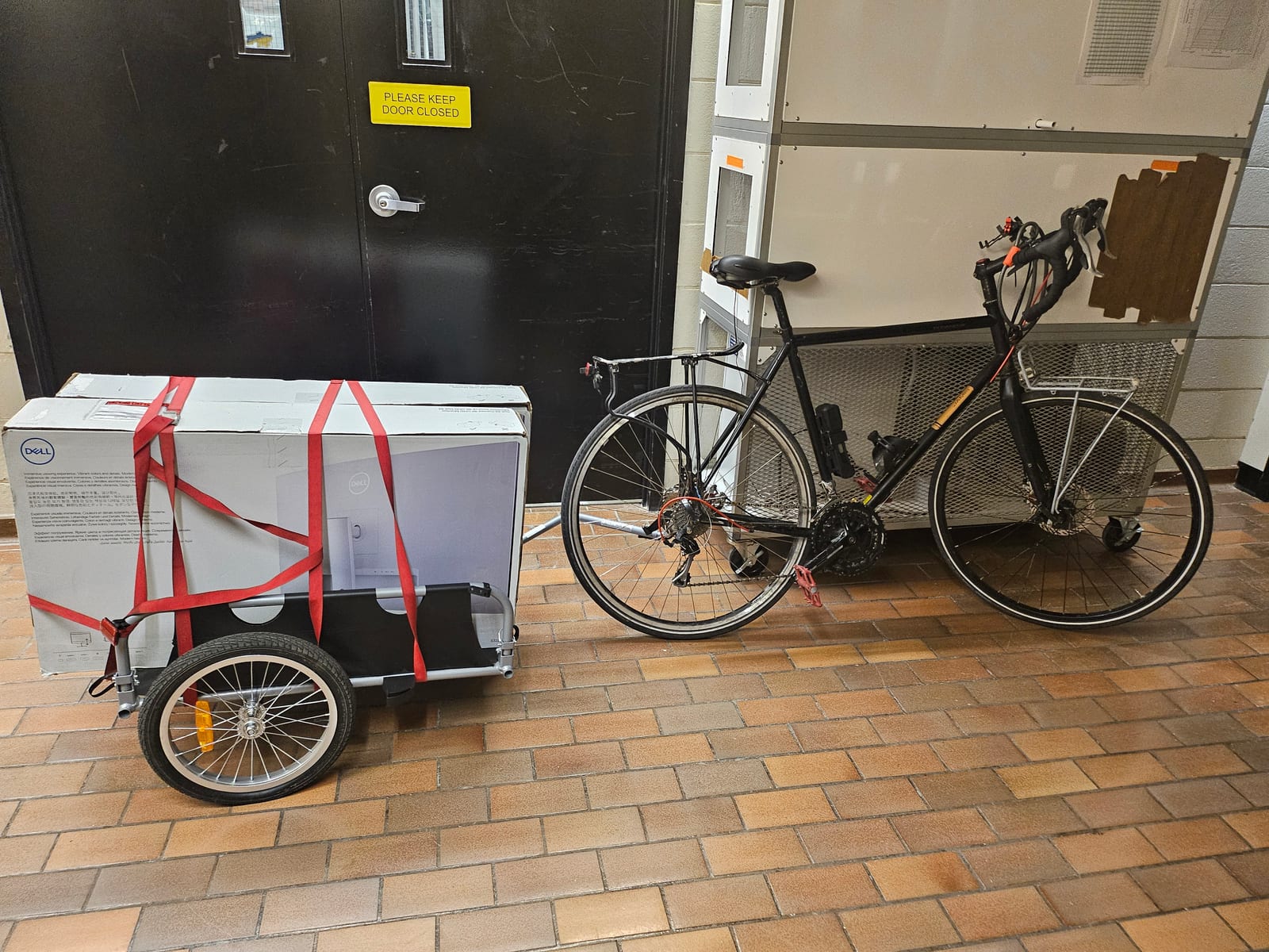 A bicycle and trailer used to move lab equipment