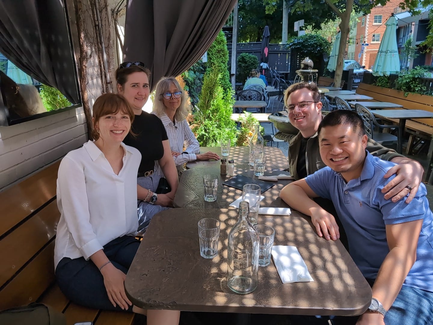 Lab members sharing an outdoor lunch