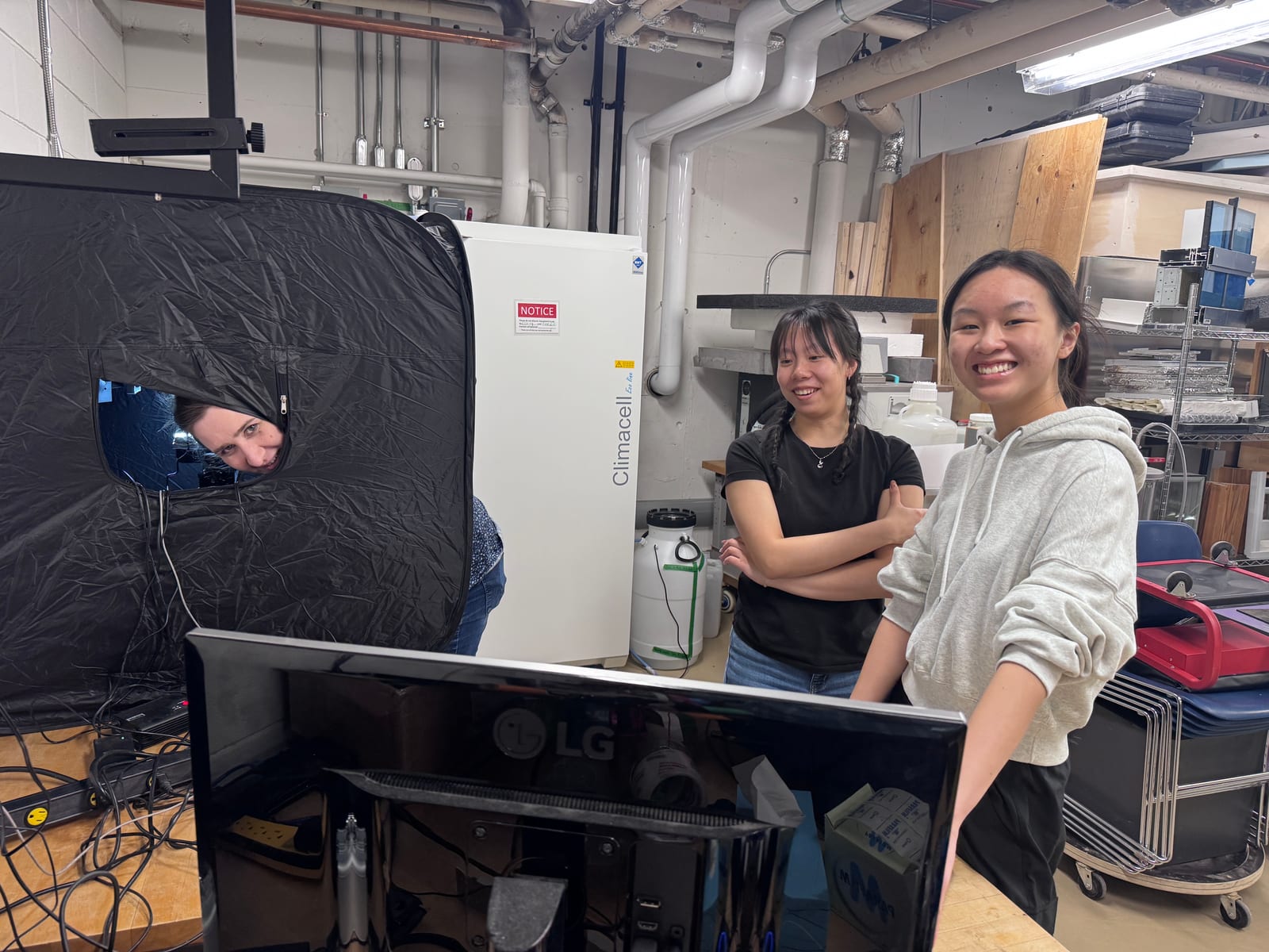 Students setting up measurement equipment in the lab