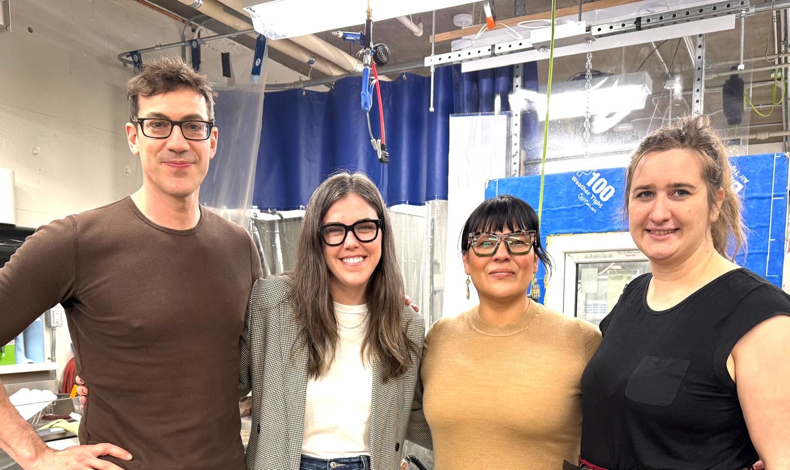 Four research collaborators in the building-science lab