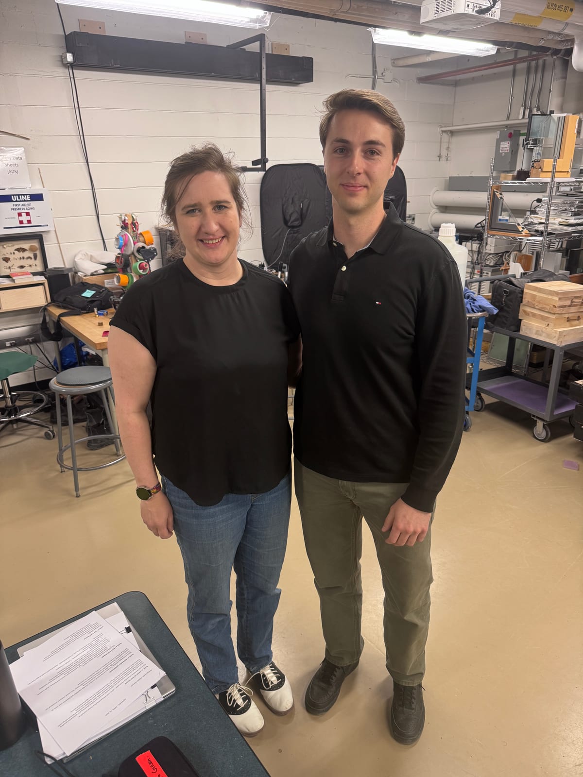 Helen with a student after a research milestone